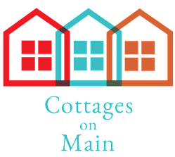 A graphic of three houses with the words "Cottages on Main" written below them.
