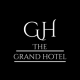a logo for the grand hotel