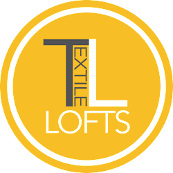 A yellow circle with the letters "TL" and "LOFTS" written on it.