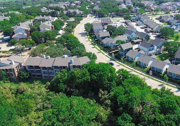 A suburban neighborhood with houses and trees.