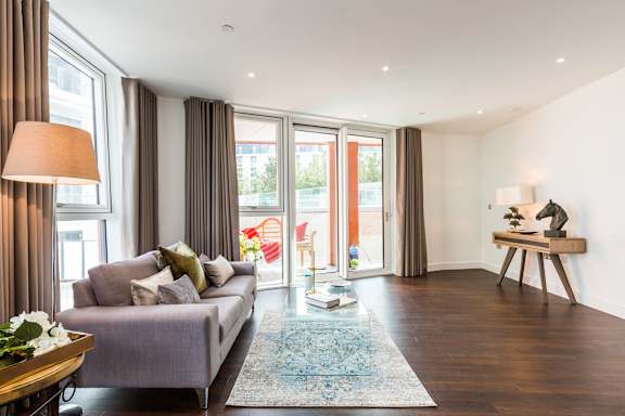 a living room with a couch and a rug