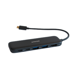 A black Anker power bank with a USB cable attached.
