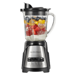A blender full of fruit and yogurt.