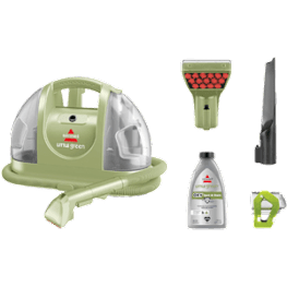 A green vacuum cleaner with its accessories.