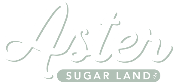 White logo  at The Aster Sugar Land Apartments, Sugar Land, Texas