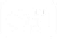 A green sign with the words Mount Carmel Manor on it.