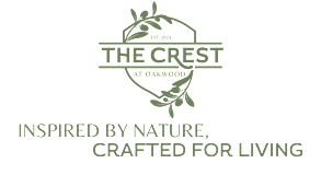 The Crest at Oakwood logo with the tagline "Inspired by nature, crafted for living".