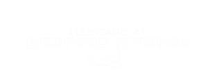 a logo for heritage at bedford springs