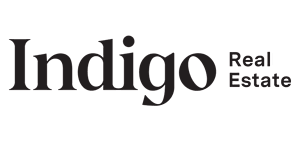 the logo for indigo real estate
