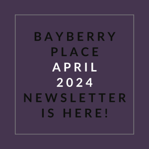 a white frame with the words babyberry place april 2024 newspaper is here