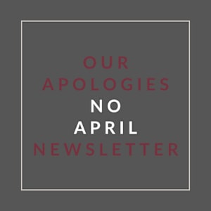 A poster with the text "Our Apologies No April Newsletter" written in red and white.