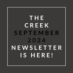 a white font on a black background with the words the creek september 2024