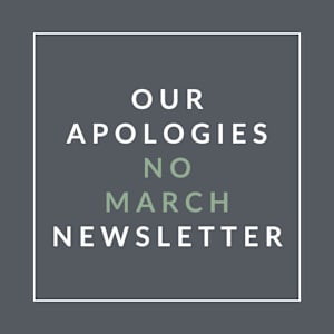 A poster with the text "Our Apologies No March Newsletter" written on it.
