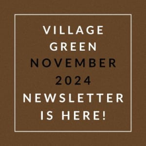 a sign that says village green november 2024 newsletter is here