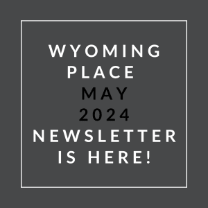 a white frame on a black background with the text winning place may 2024 newsletter is
