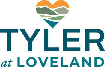 A logo with the text "TYLER at LOVELAND" and a heart-shaped mountain graphic.