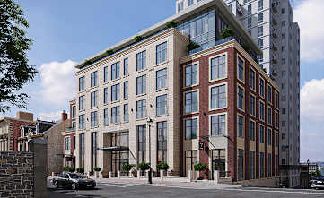 A modern building with a mix of brick and glass exterior.