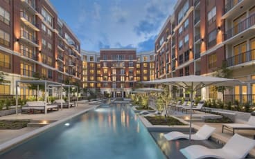 a swimming pool in front of a building