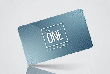 a close up of a one vip club sticker on a laptop computer