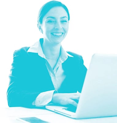 a woman sitting in front of a laptop computer