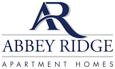 A blue sign with the words at Abbey Ridge Apartment Homes, Oxford, MI, 48371