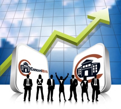 a group of people standing in front of a line of graphs