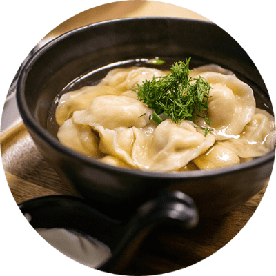 a bowl of dumplings in a bowl on a table