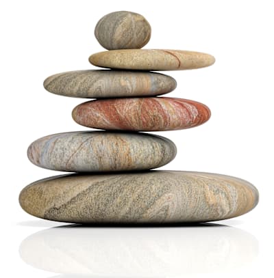 A stack of six stones with different colors and patterns.