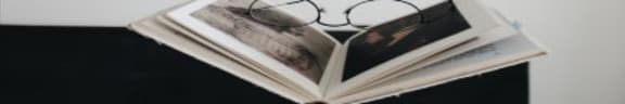 Image of book with glasses on bed1