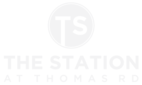 a white and black logo on a black background