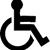 A black and white image of a person in a wheelchair.