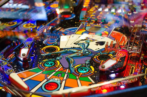 a close up of the playfield of a pinball game