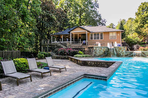 A house with a pool in the backyard.