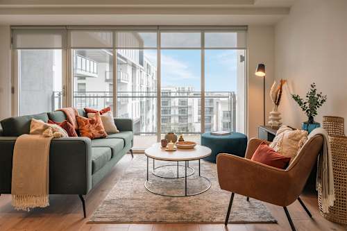 A living room with a couch, chair, and coffee table.