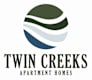 A logo for Twin Creeks Apartment Homes.