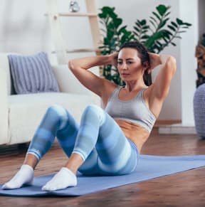 Woman working out at home The Mezzo Apartments 