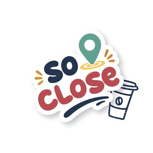 A sticker with the text "so close" and a coffee cup.