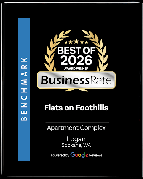 A black and gold award for Flats on Foothills Apartment Complex.