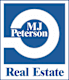 a white and blue real estate sign with the word real estate in a white circle