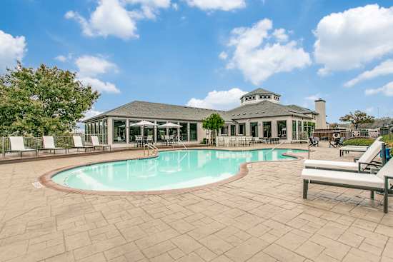 A large house with a pool in the backyard.