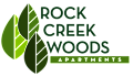 The image is a logo for Rock Creek Woods Apartments.
