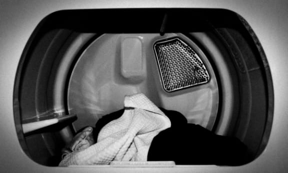 inside of dryer with clothes