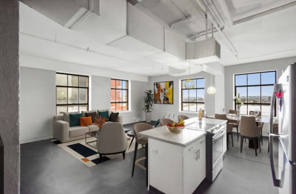 a living room with a kitchen and a dining room