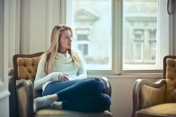 renter looking out window
