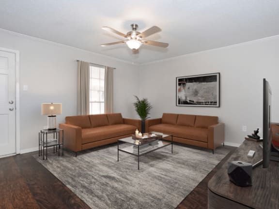 a living room with couches and a coffee table