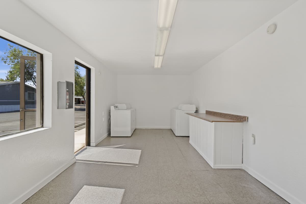 Illustrative manufactured-home interior: laundry and utility area — view 1 at Paradise Groves Manufactured Home Community.