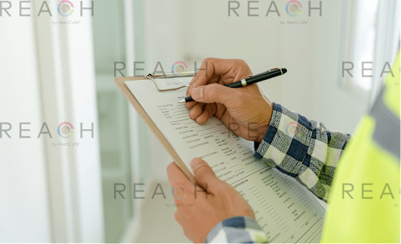 A person is filling out a form with a pen.