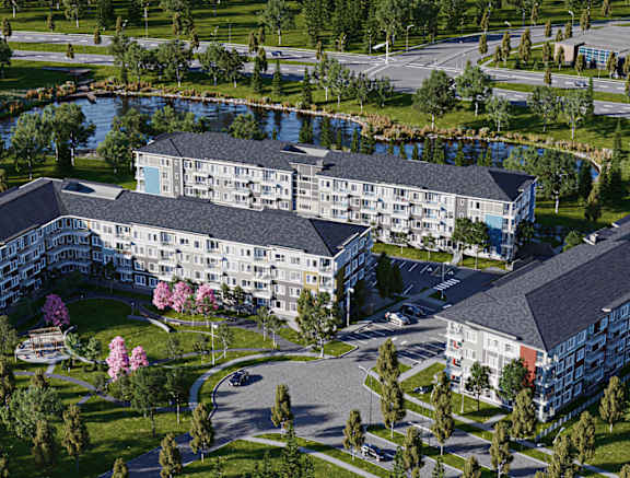a series of building with trees and a body of water