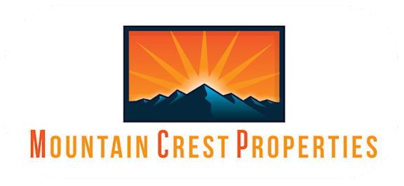 A logo for Mountain Crest Properties featuring a sun rising over mountains.