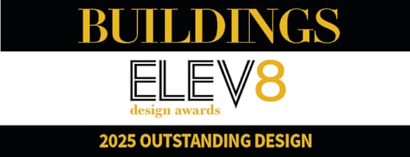 A black and gold sign that says "Buildings Elev8 Design Awards 2025 Outstanding Design".